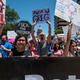 Protesters hold up signs at a protest outside the Texas state capitol on May 29, 2021 in Austin, Texas. Thousands of protesters came out in response to a new bill outlawing abortions after a fetal heartbeat is detected, signed on Wednesday by Texas Governor Greg Abbot.